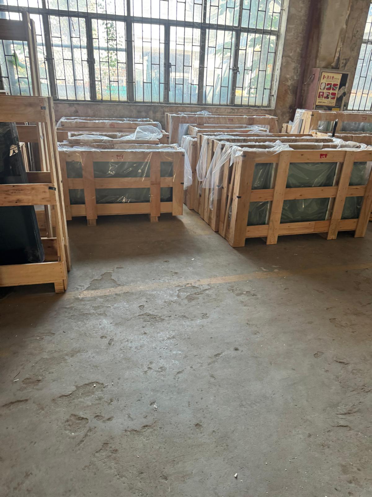 Wrapped crates of glass packed for distribution