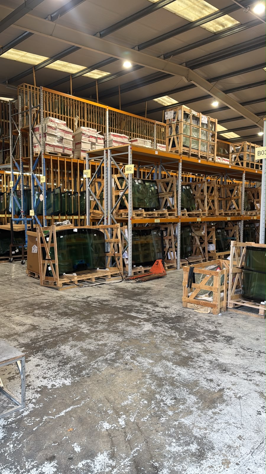 Tall racking filled with crated windscreens and side glass